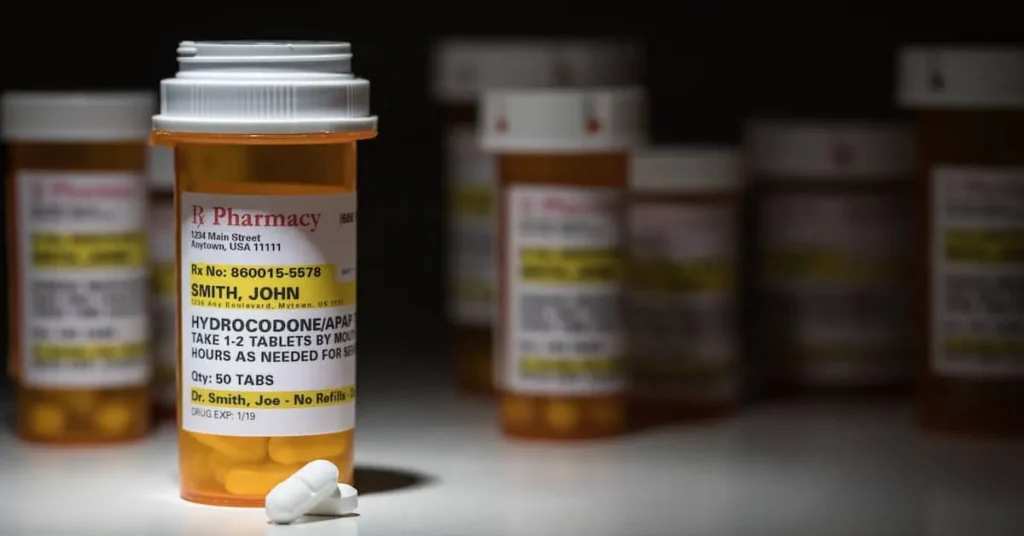 Prescription medication bottles with pills on a table